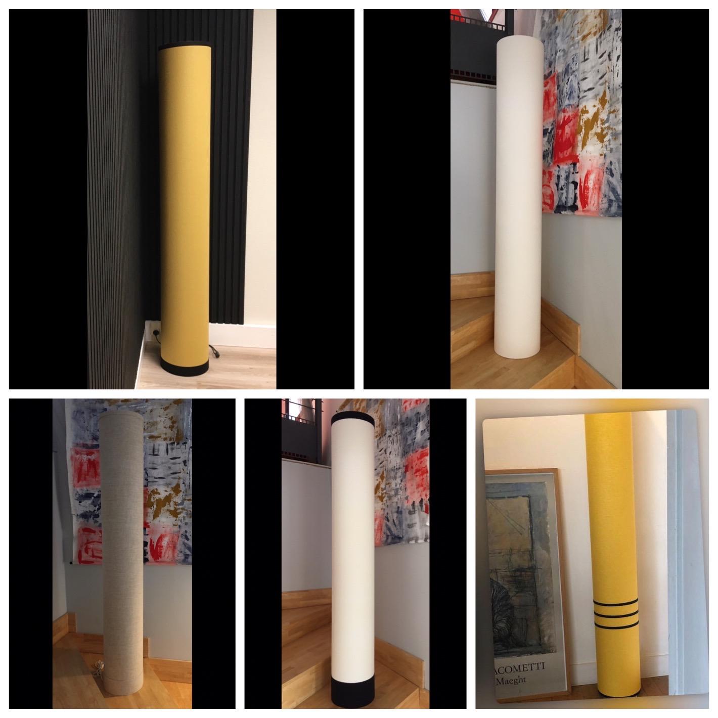 Montage de plusieurs lampes cylindriques hautes dans des teintes ivoire et jaune